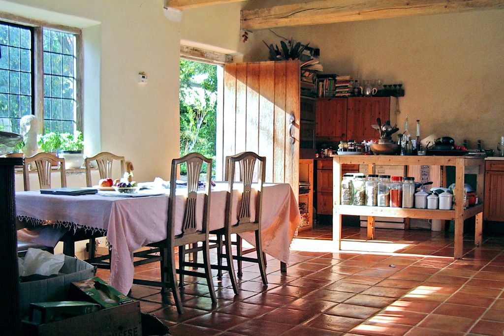 kitchen of upper red house, with sunlight streaming in