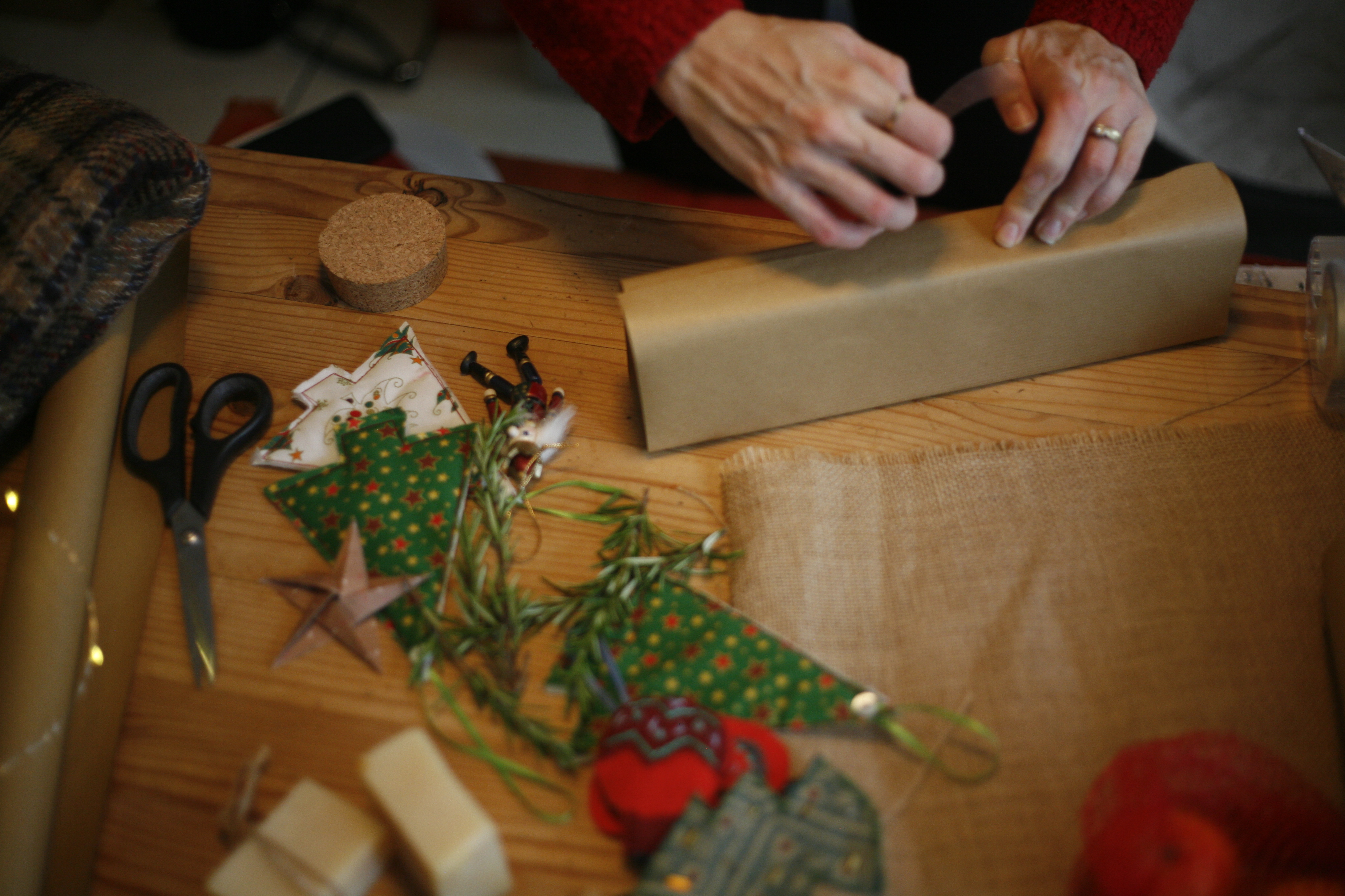 wrapping a present with brown paper