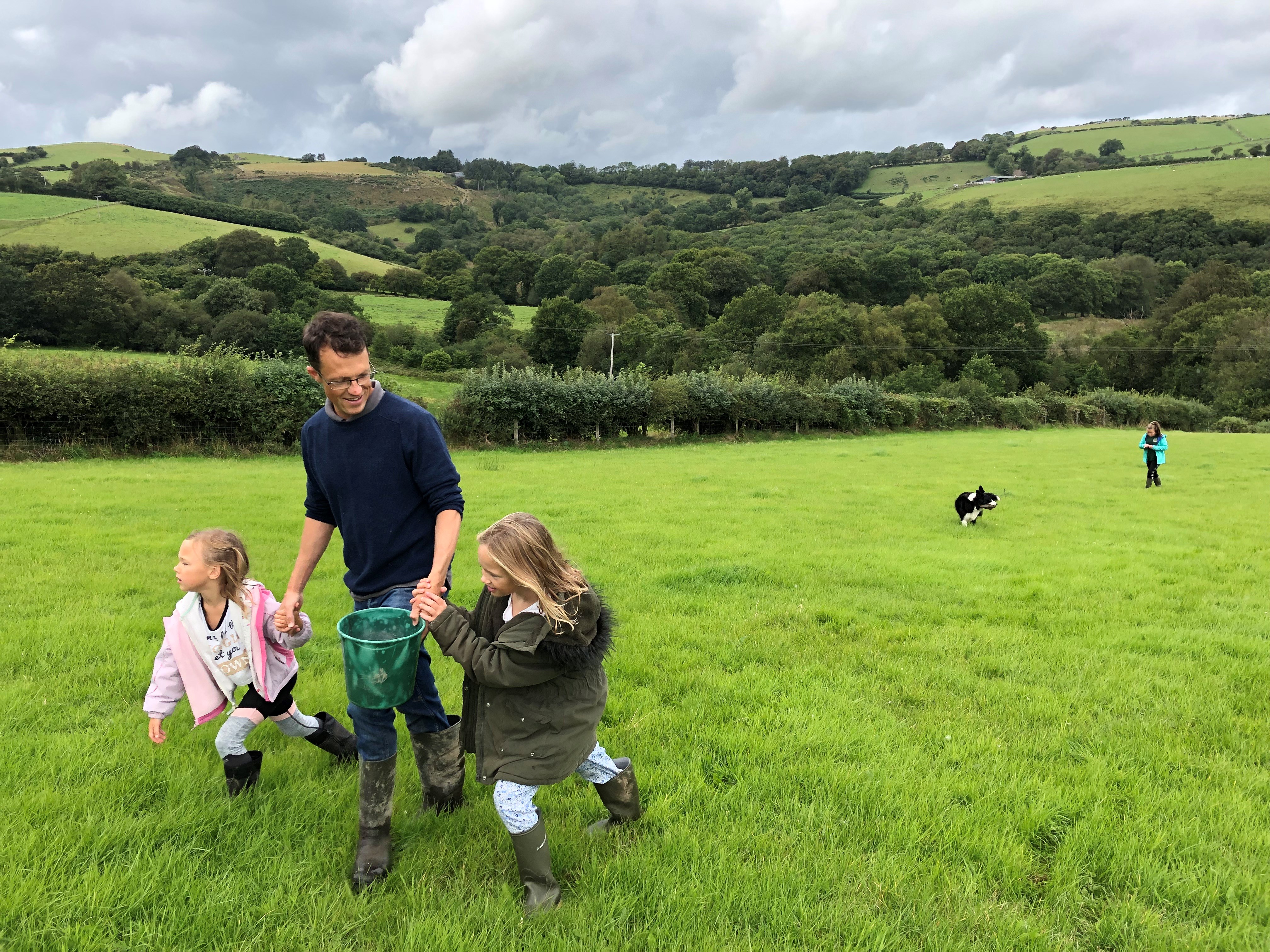 Jack Cockburn and his family walking across a field