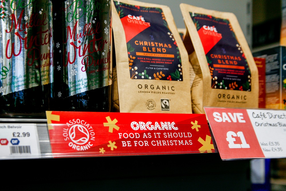 shelf in indie supermarket selling festive items, with organic christmas shelf strip