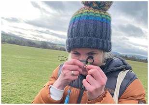Karen Fisher examining seedling, Barns Farm, Shropshire