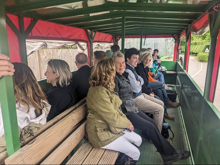 Photo of Helen Browning and others from the King Charles lll Charitable Fund on a farm tour at Bradwell Grove in Oxfordshire.